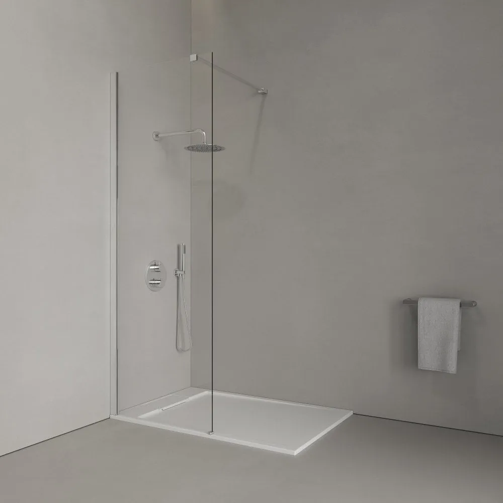 Tiled shower room with glass screen and chrome fittings