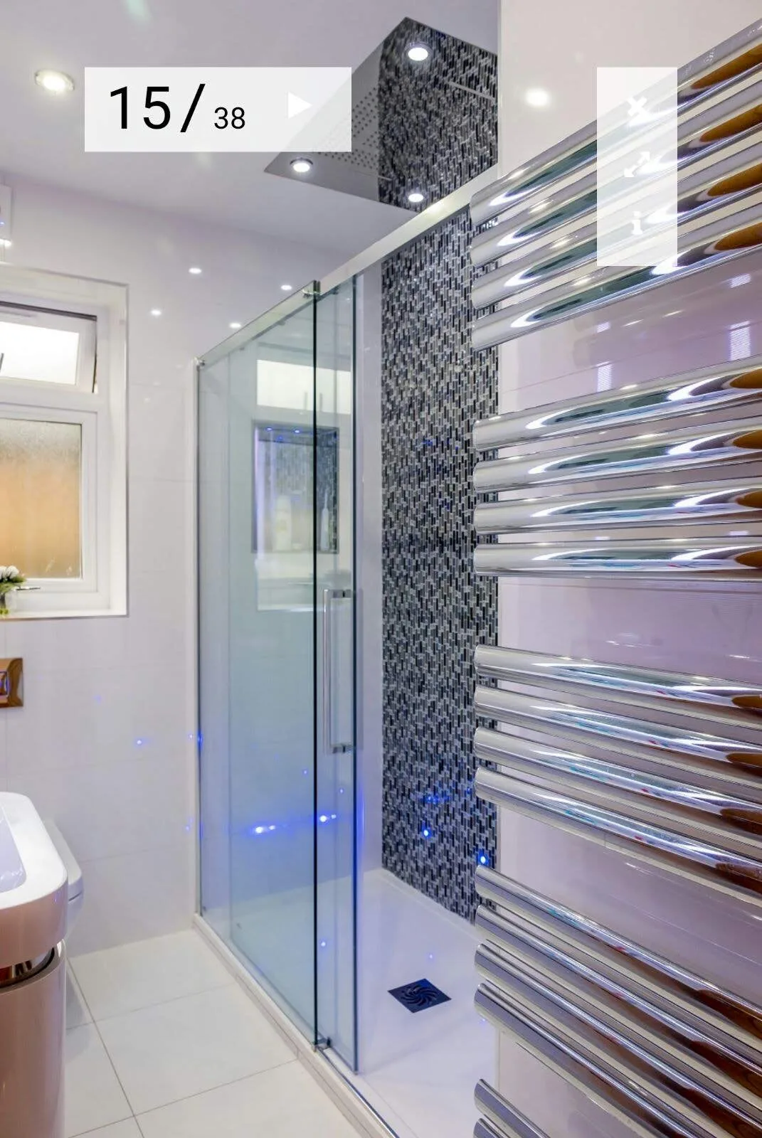 Modern bathroom installation with walk-in shower, fitted vanity unit and contemporary bathroom tiles in Walthamstow