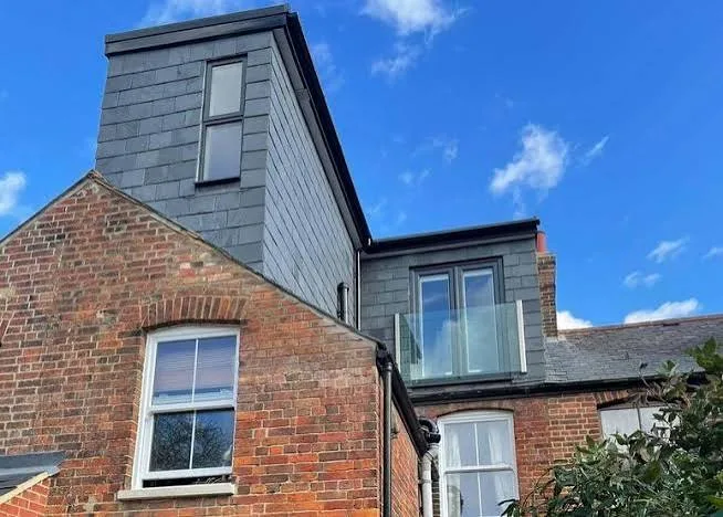 L shaped dormer loft conversion for additional bedroom and living space.